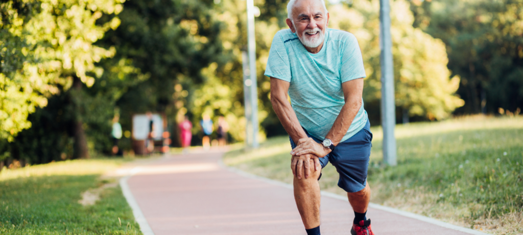 Elderly man exercising in the park.